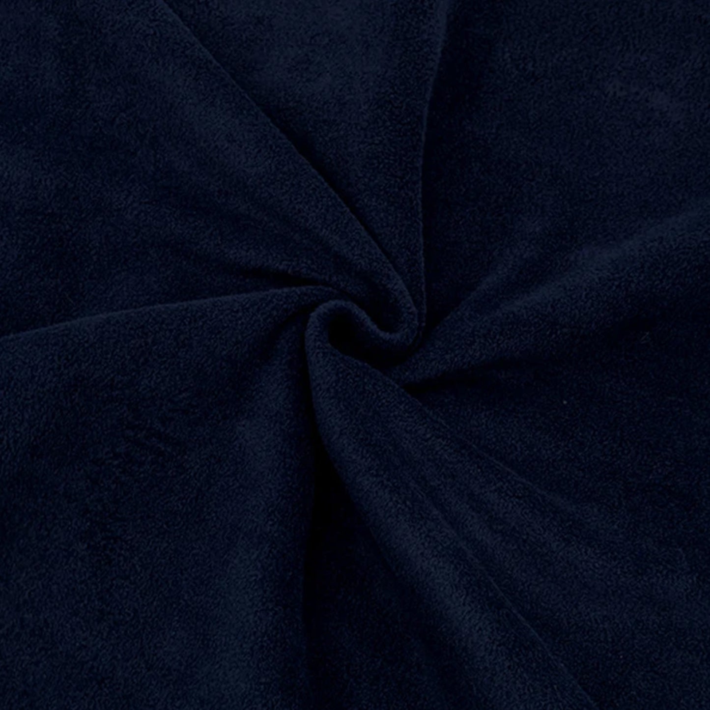Close up of dark navy blue anti-pil polar fleece fabric showing soft plush texture