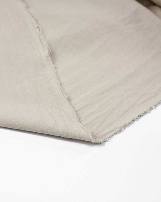 Folded over crinkle washed cotton fabric in off white