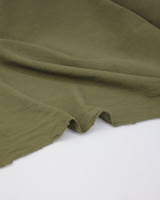 Washed crushed cotton fabric in green
