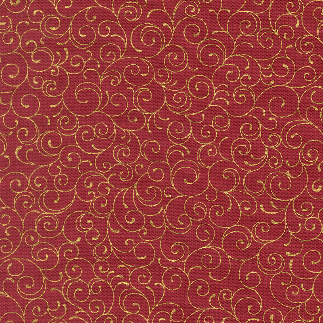 Red cotton fabric with gold swirling pattern