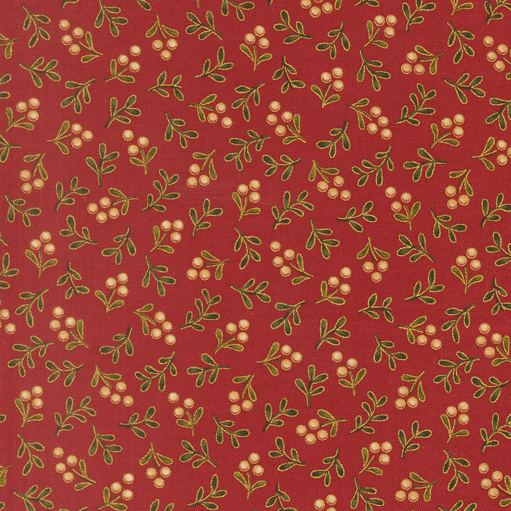 Pattern of green leaves and white berries on a red quilting cotton with metallic gold detailing