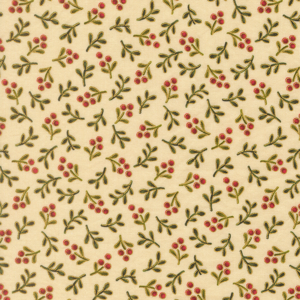 Pattern of green leaves and red berries on a cream quilting cotton with metallic gold detailing