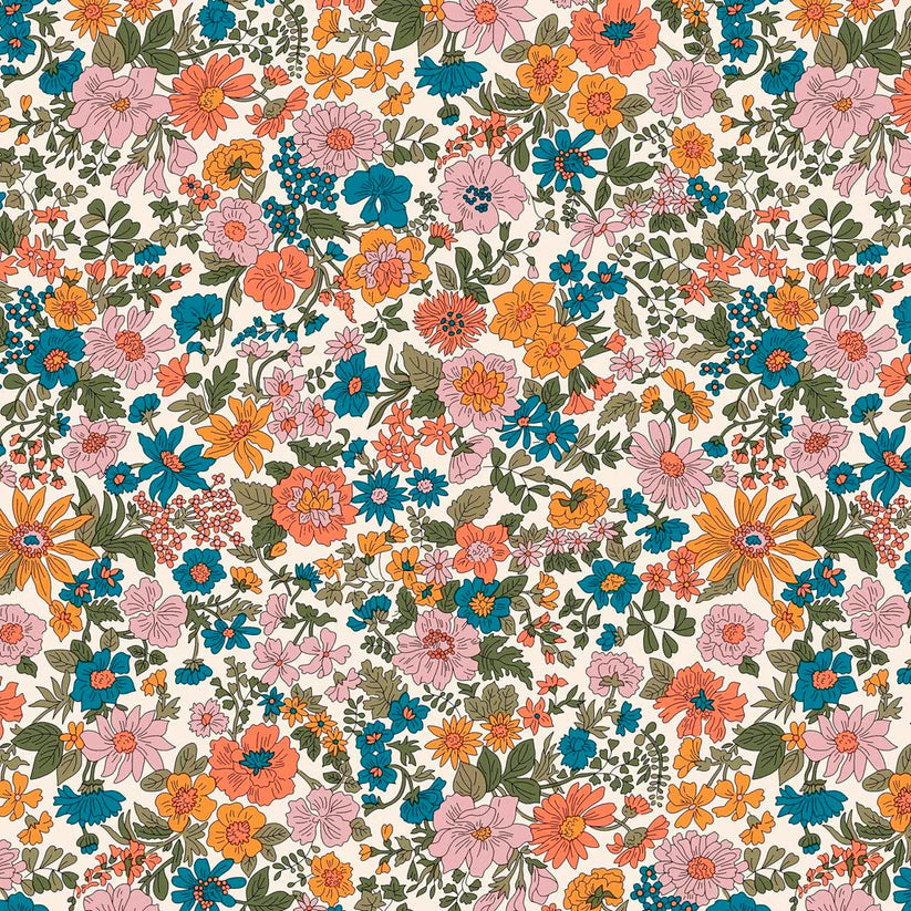 Pattern of flowers in orange, pink and blue with green foliage on a white quilting cotton