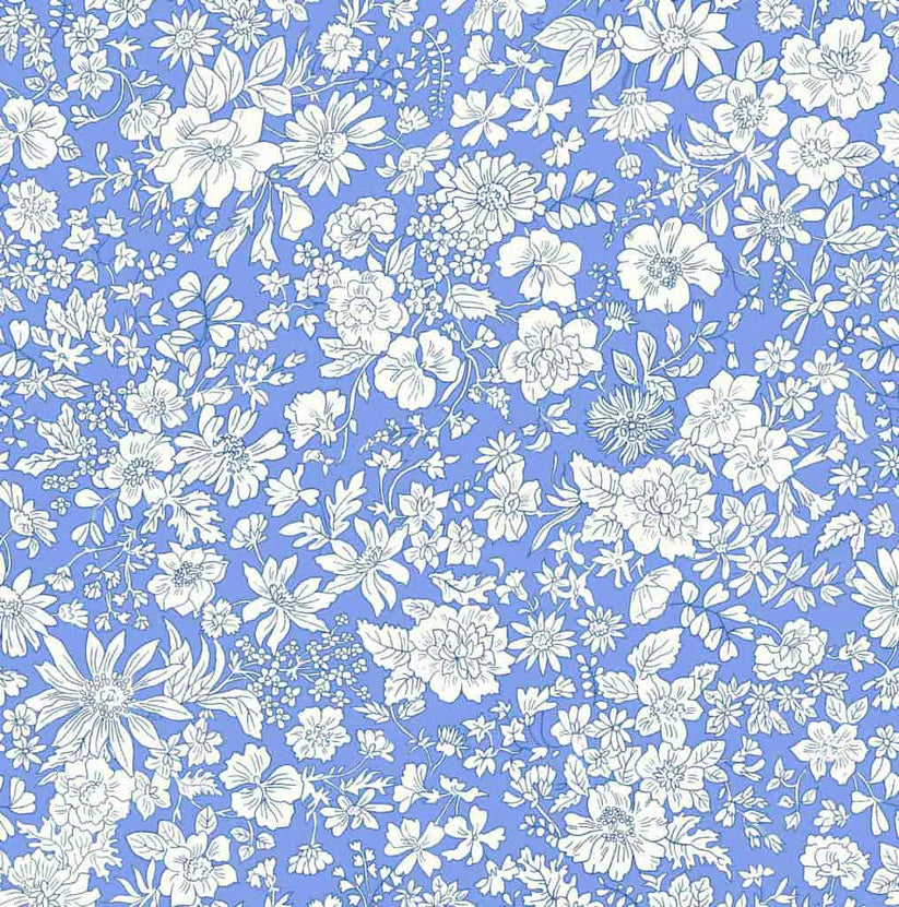 Ivory floral pattern on a bright blue quilting cotton