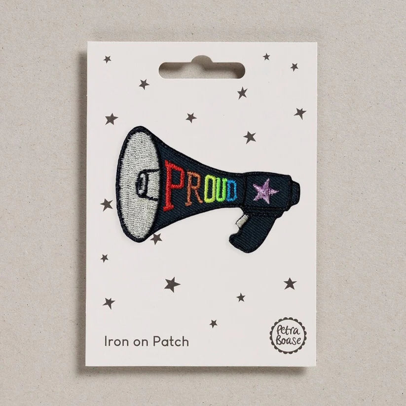 Petra Boase Proud megaphone iron-on embroidered patch featuring a colourful megaphone design with the word Proud on presentation card.