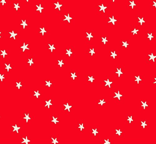 A repeating pattern of small white hand-drawn star shapes on a bright red quilting cotton