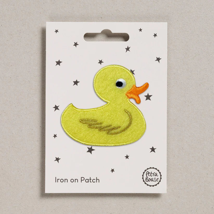 Petra Boase rubber duck iron-on embroidered patch featuring a bright yellow duck design on presentation card