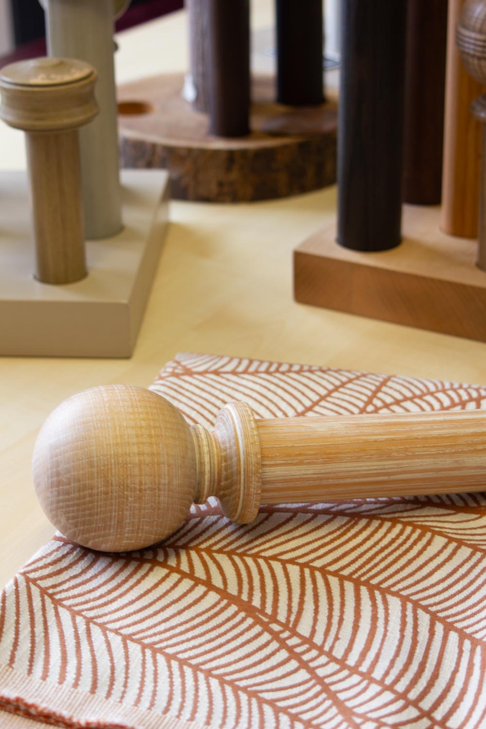 Wooden curtain pole displayed with complementary patterned fabric