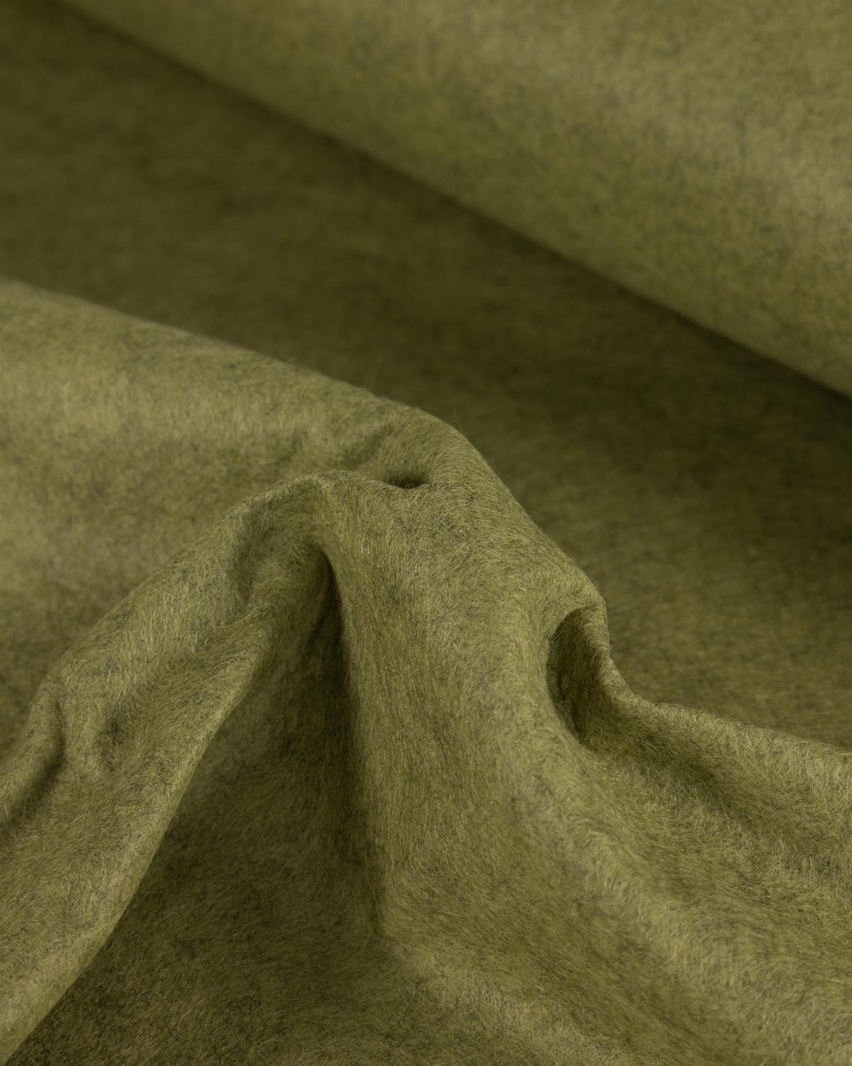 A close-up of moss green wool and viscose marl felt fabric with a soft, textured surface, draped in folds to show its tactile quality.