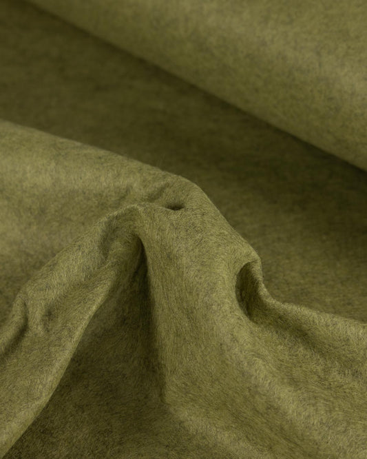 A close-up of moss green wool and viscose marl felt fabric with a soft, textured surface, draped in folds to show its tactile quality.