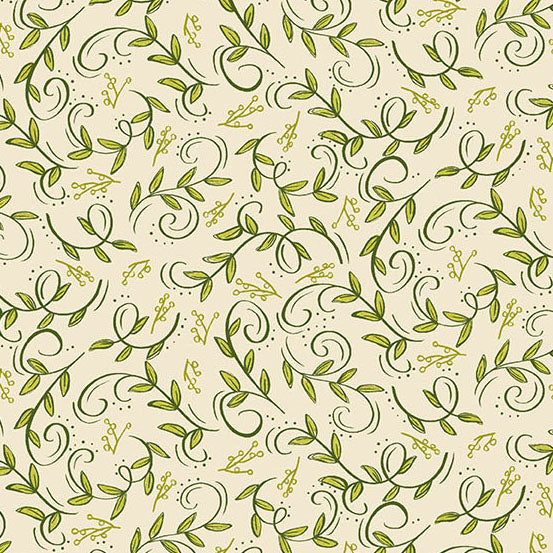 Swirling green foliage in green on a cream quilting cotton