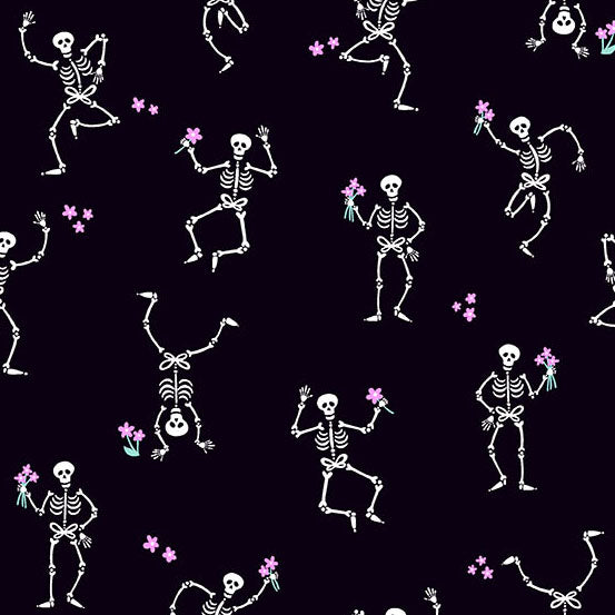 Pattern of dancing skeletons with flowers on a black quilting cotton