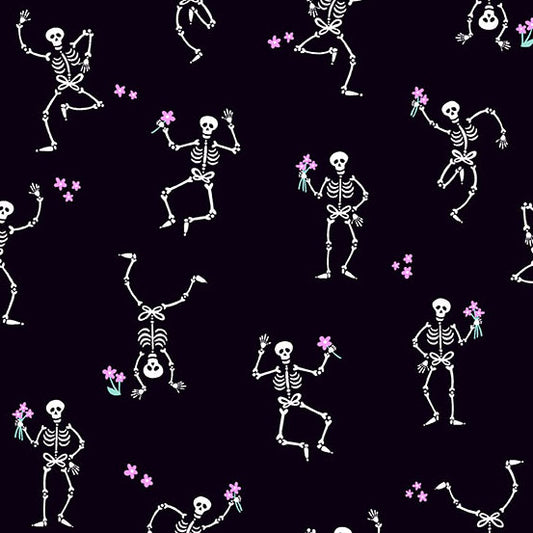 Pattern of dancing skeletons with flowers on a black quilting cotton