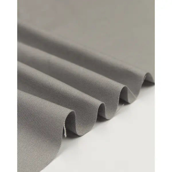 Ripple view of silver pure cotton canvas fabric showing woven texture