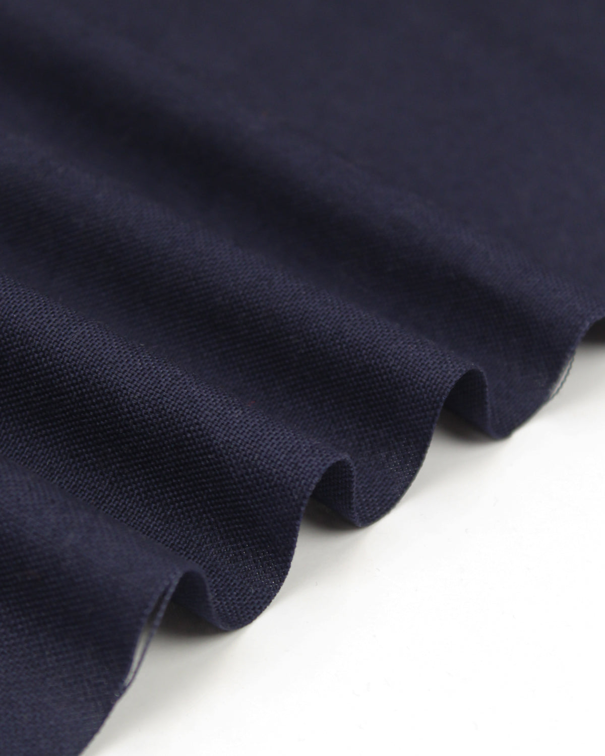 Ripple view of navy pure cotton canvas fabric with Panama weave texture