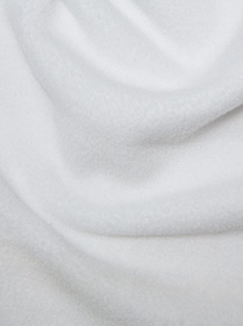 Close up of white anti-pil polar fleece fabric showing fluffy soft finish