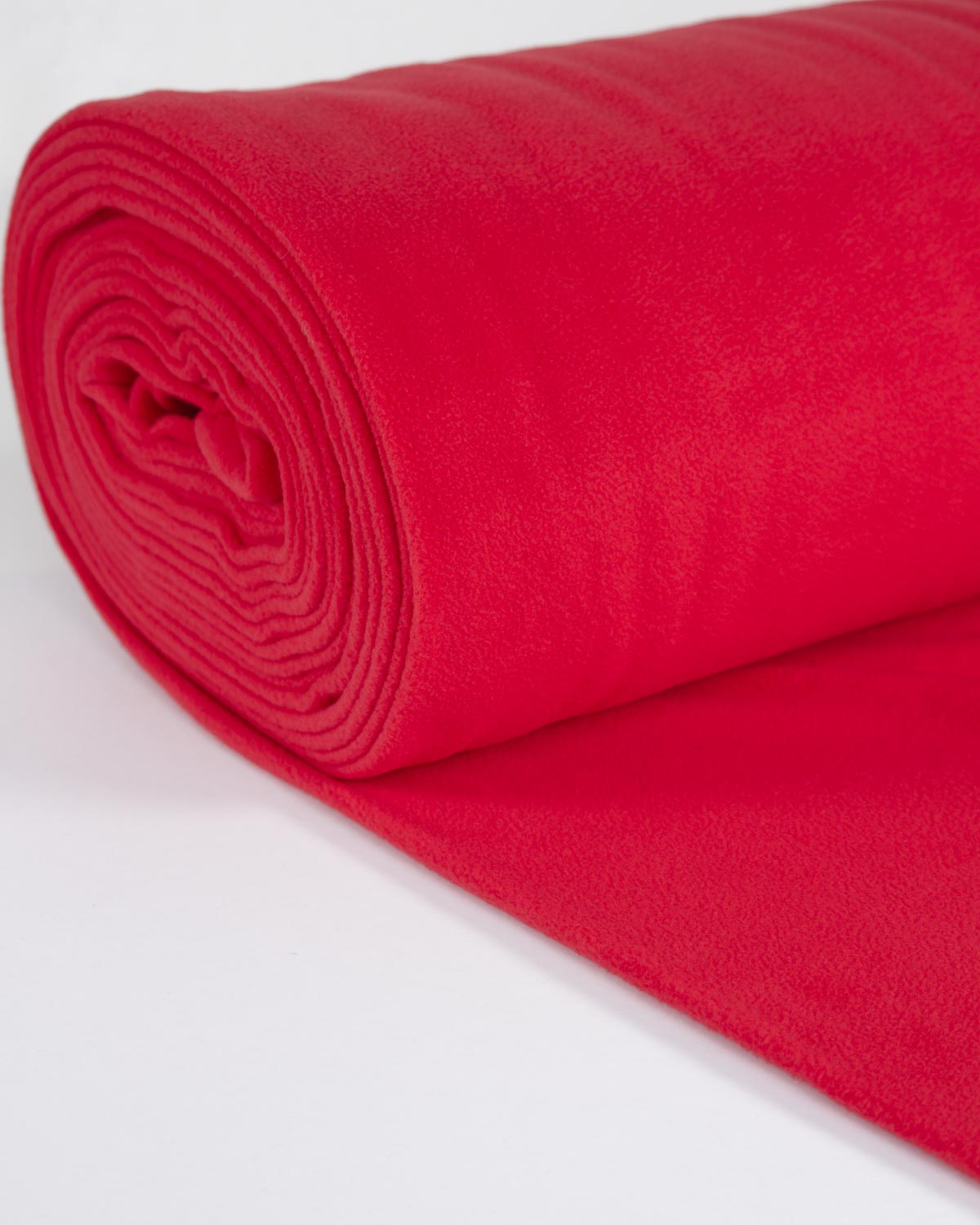 A rolled piece of bright red fleece fabric on a clean white background.