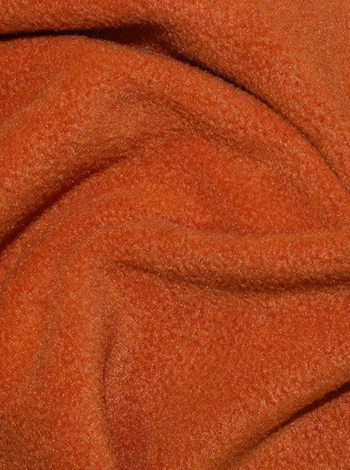 Close up of terracotta anti-pil polar fleece fabric showing soft plush texture