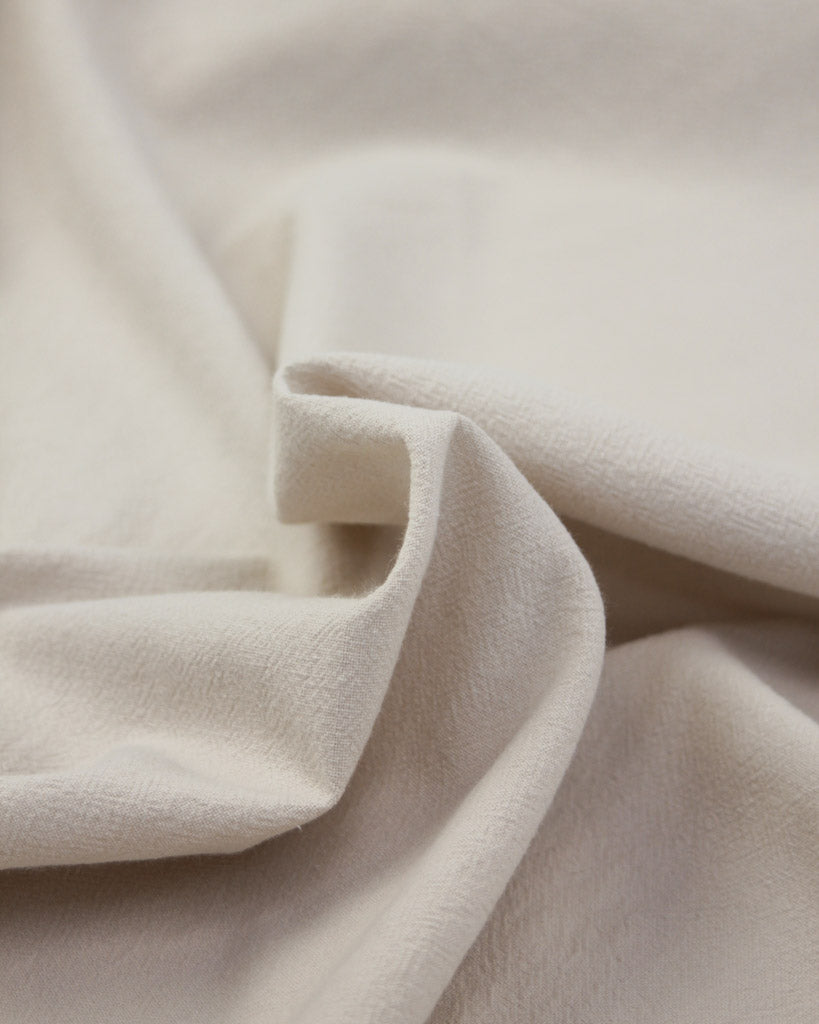 Close up of Crinkle washed cotton fabric in off white