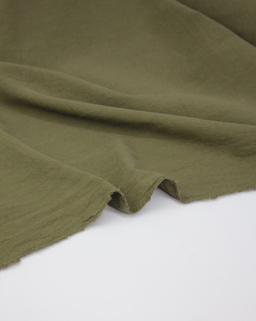 Washed crushed cotton fabric in green 