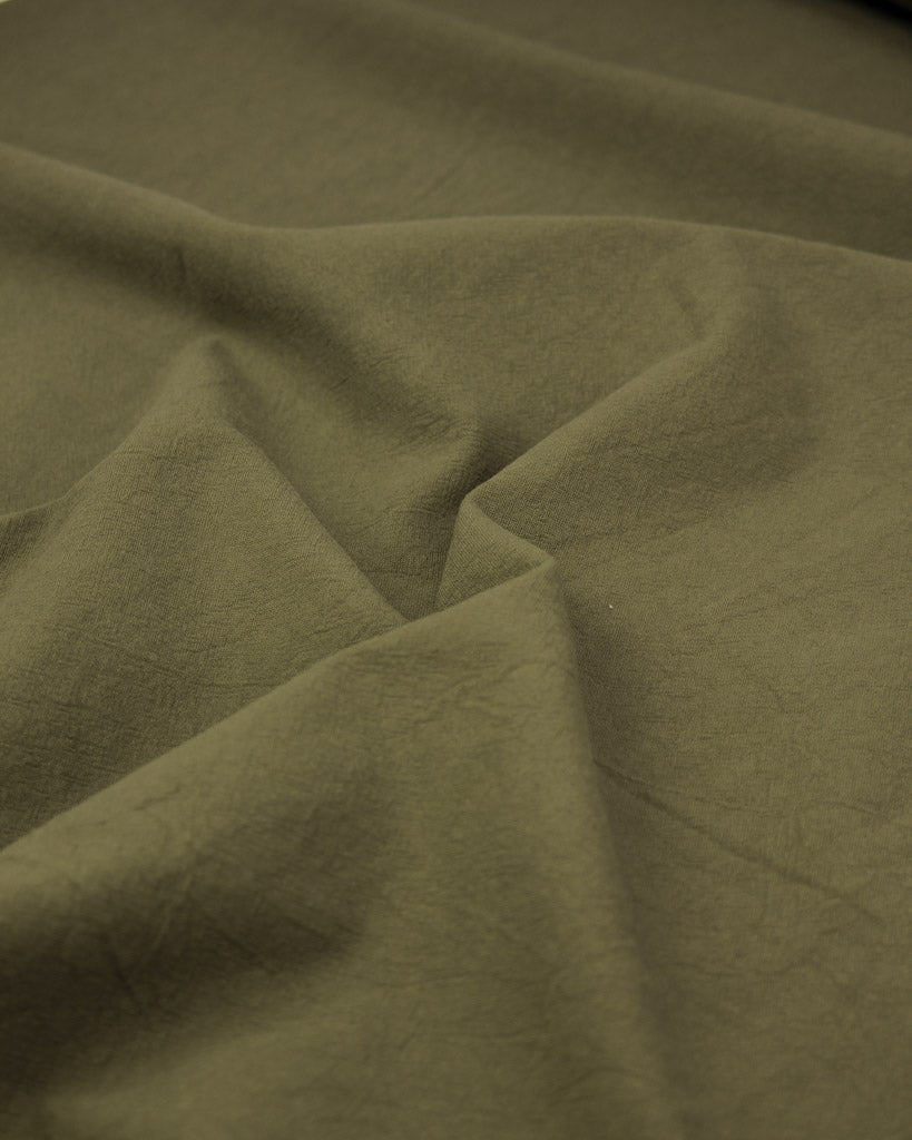 Soft washed crumpled cotton fabric in green