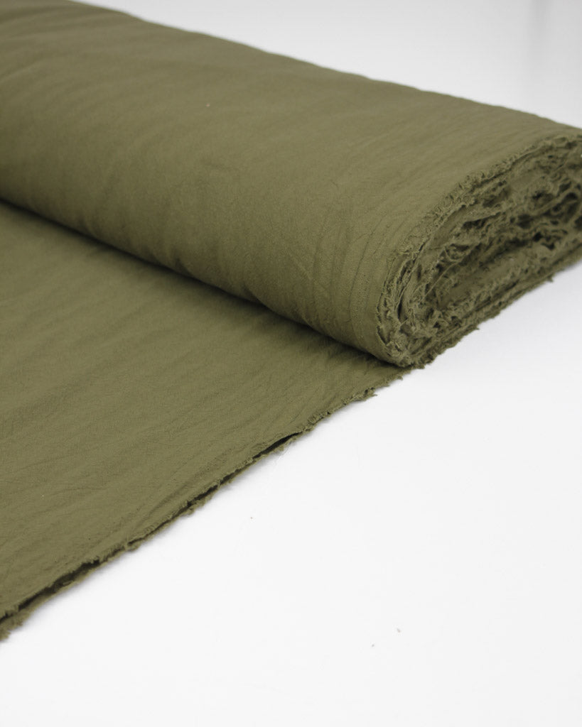 Bolt of washed cotton fabric in green