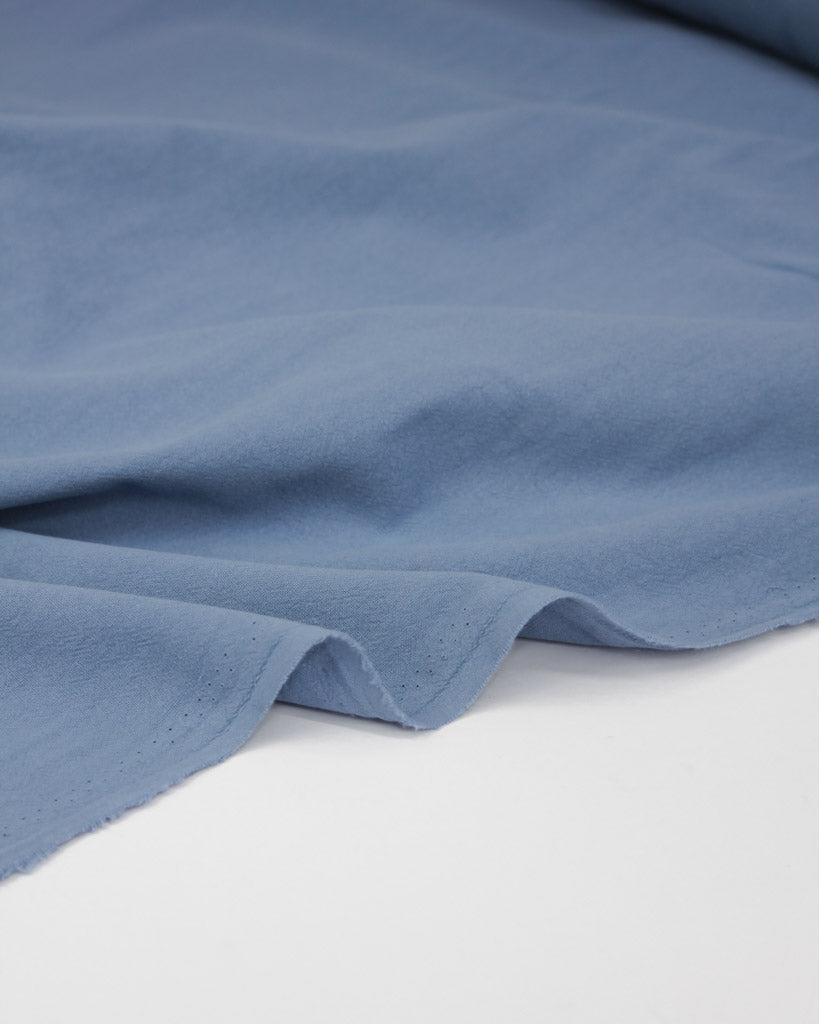 Crushed washed cotton fabric in periwinkle blue