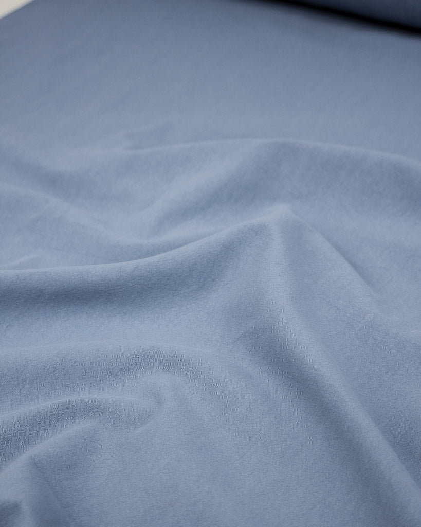 Crushed washed cotton fabric in periwinkle blue