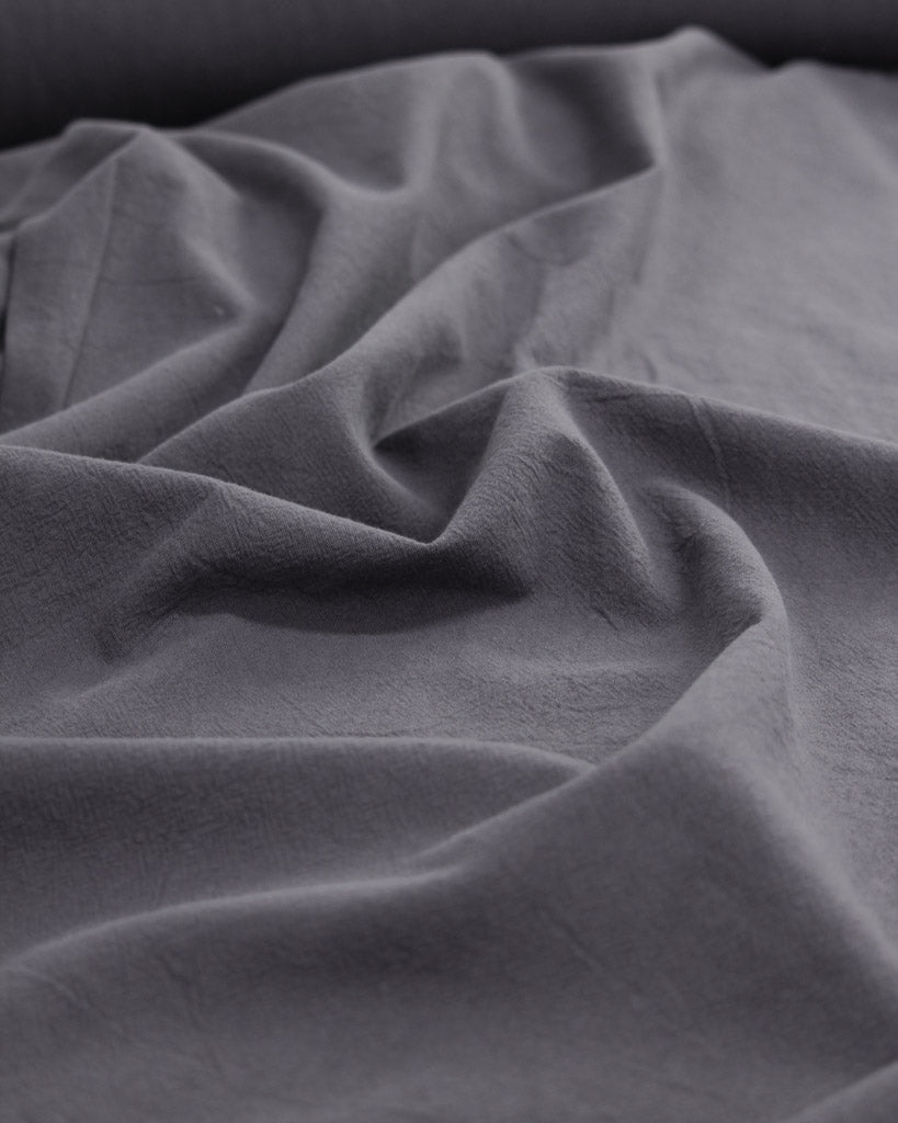 Crushed washed cotton fabric in dark grey