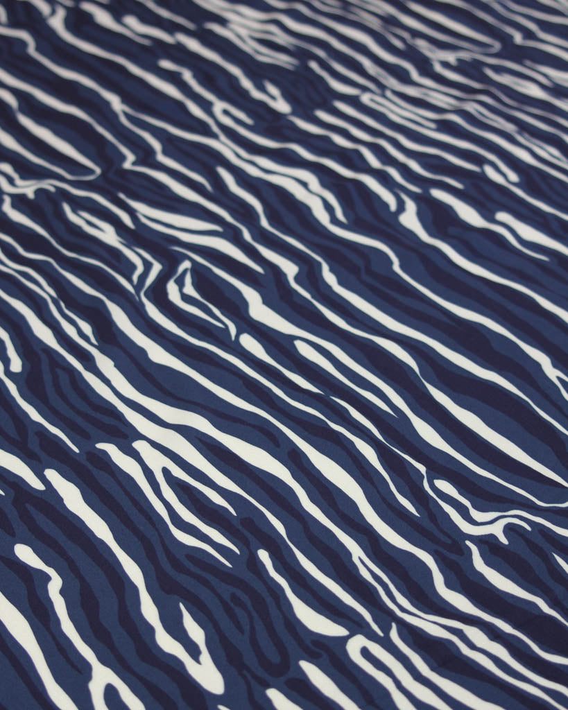 drapey viscose twill fabric with irregular navy blue and white line stripes