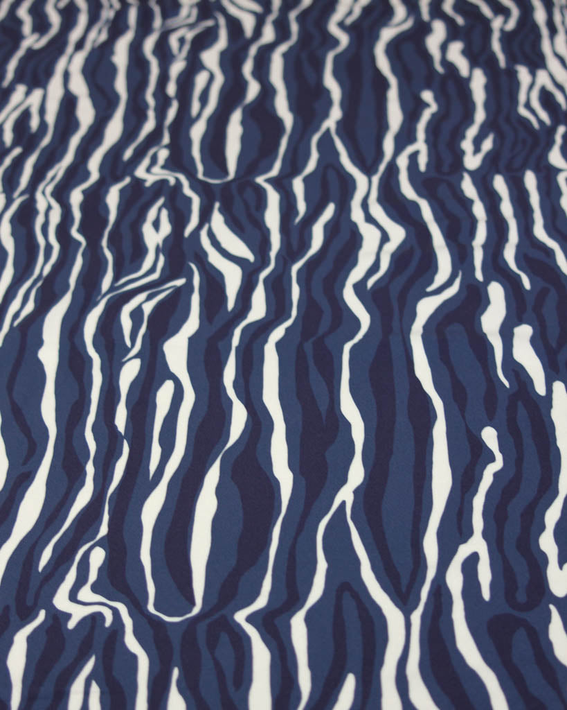 drapey viscose twill fabric with irregular navy blue and white line stripes