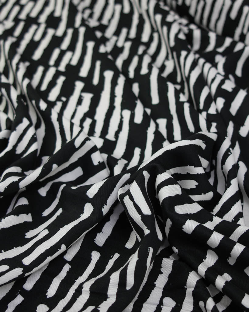 Black and white patterned viscose twill fabric