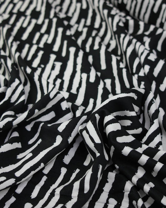 Black and white patterned viscose twill fabric