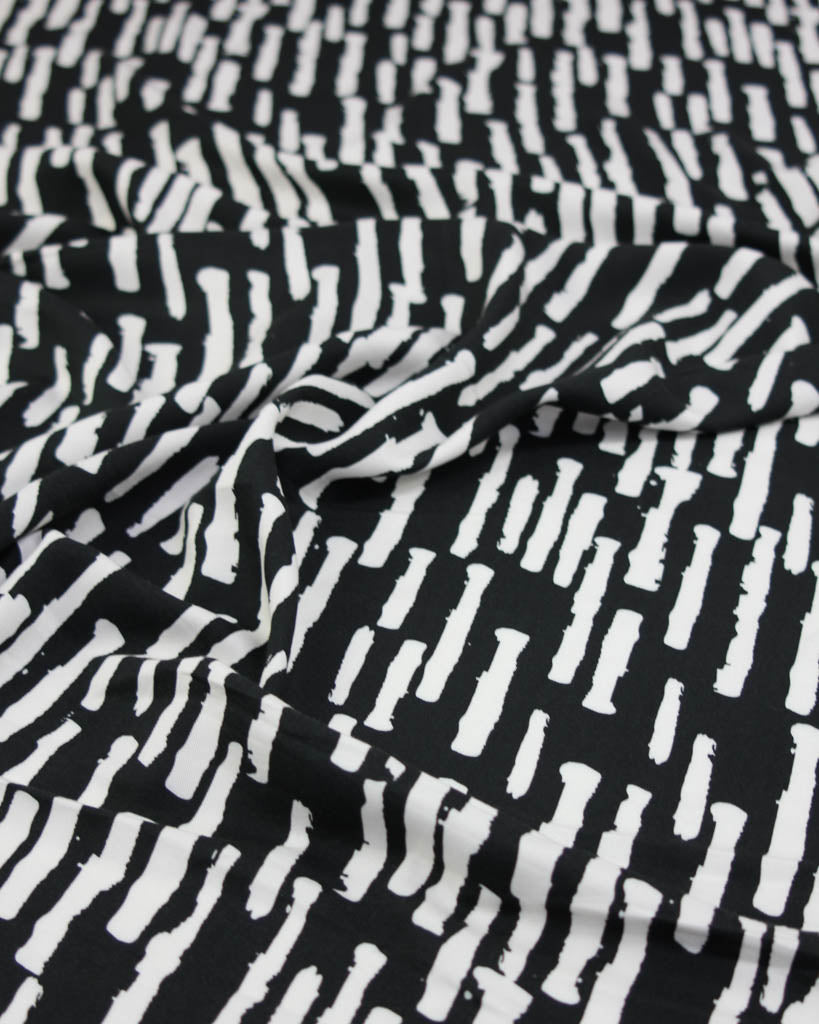 Black and white patterned viscose twill fabric
