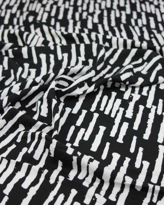 Black and white patterned viscose twill fabric