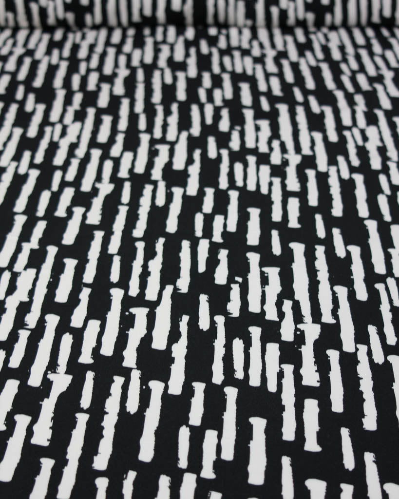 Black and white patterned viscose twill fabric