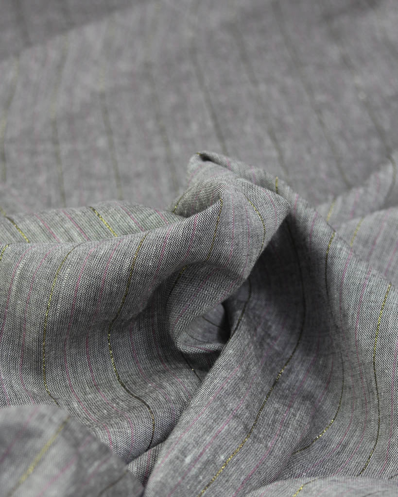 Close-up of grey linen and viscose fabric with a subtle metallic stripe 