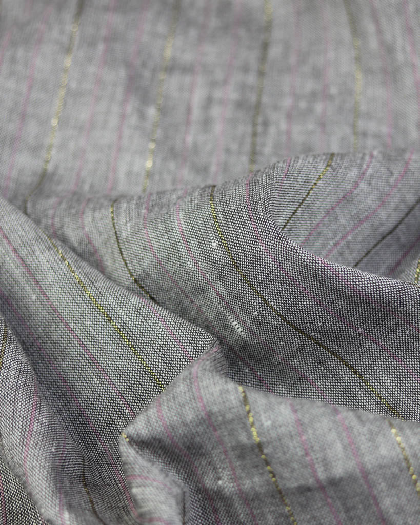 Close-up of grey linen and viscose fabric with subtle stripe pattern