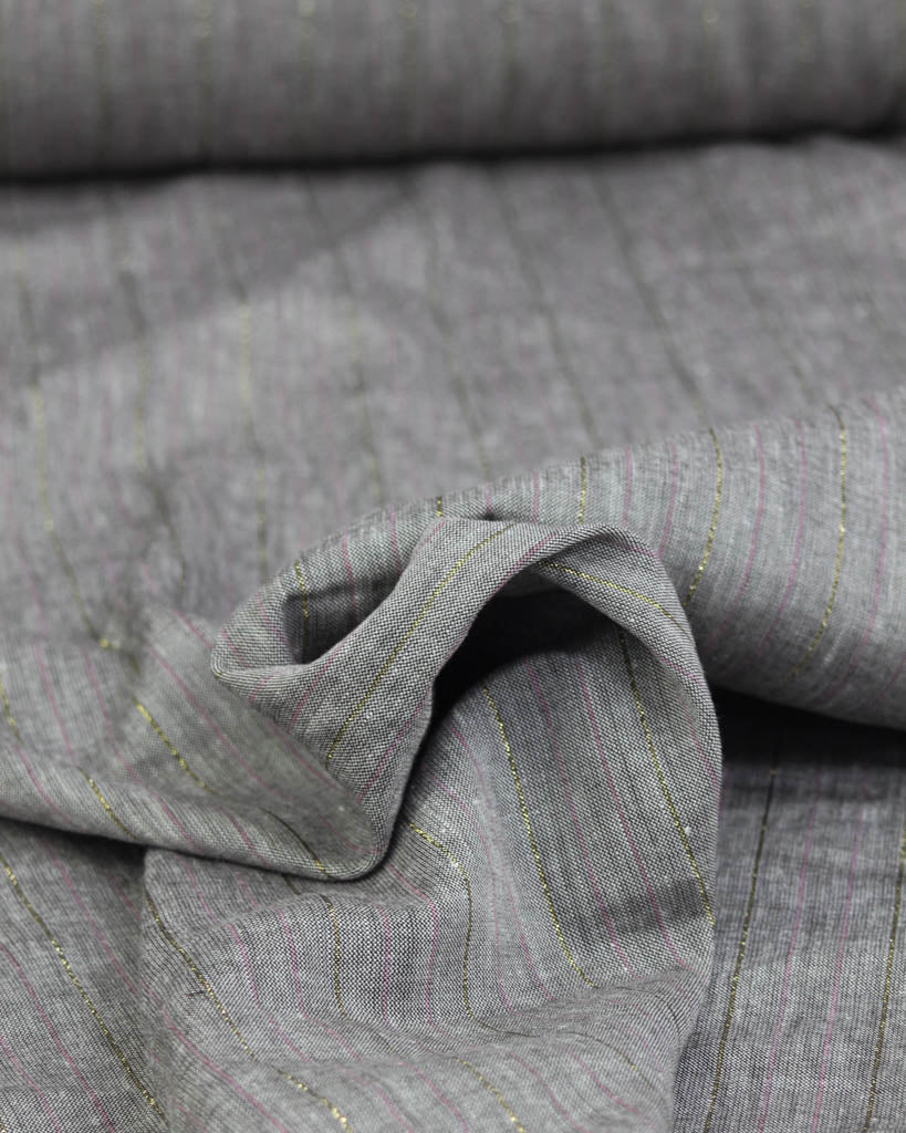 Close-up of grey linen and viscose blend fabric with a subtle stripe pattern