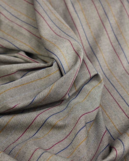 Close-up of beige poly viscose fabric with multicolored stripes