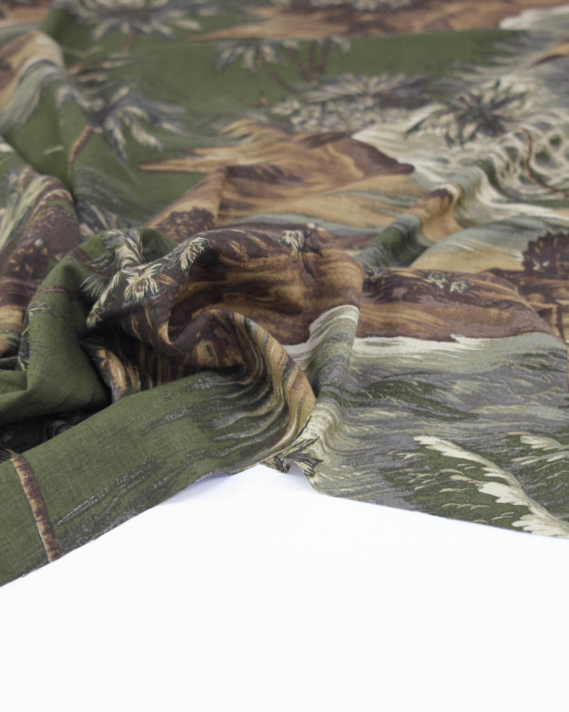 Linen viscose fabric with tropical pattern featuring palm trees and plants.