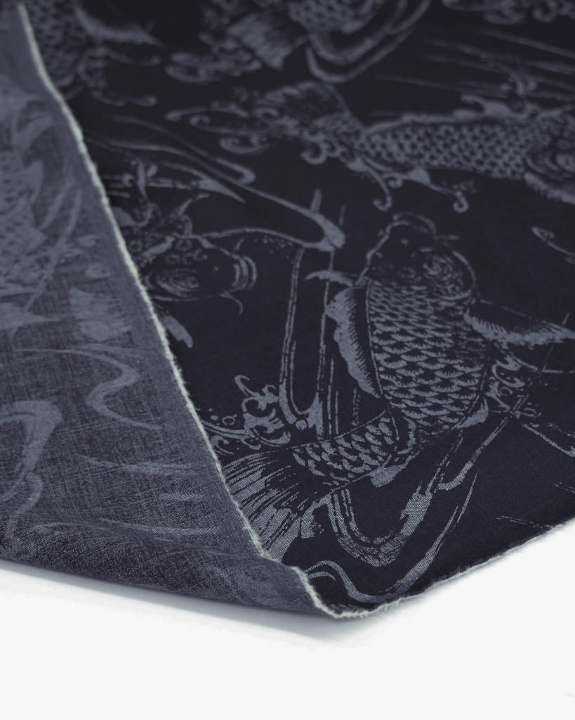 Linen cotton blend shirting fabric in dark blue with a koi fish design 