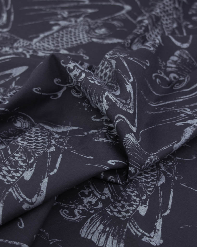 linen cotton fabric in dark blue with a koi fish design