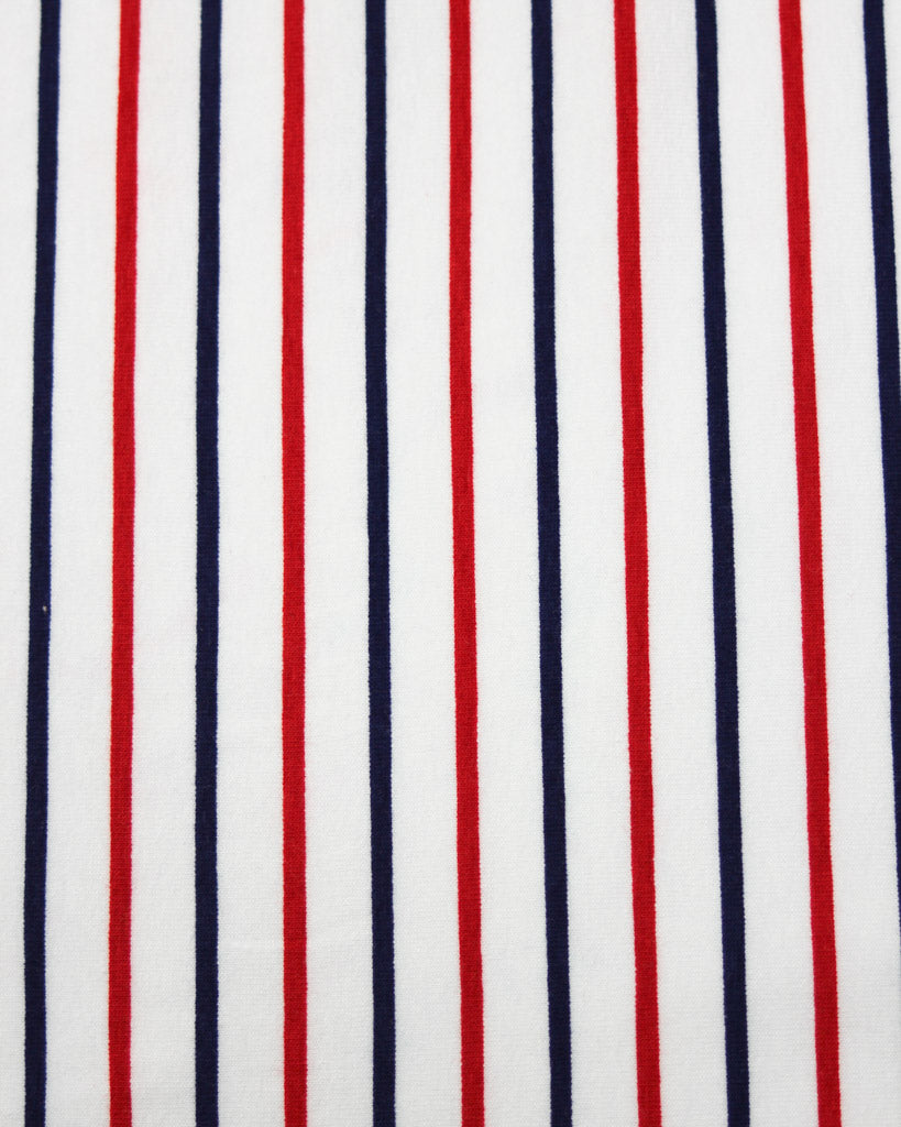 Close-up of cotton jersey fabric with red, white, and blue vertical stripes.
