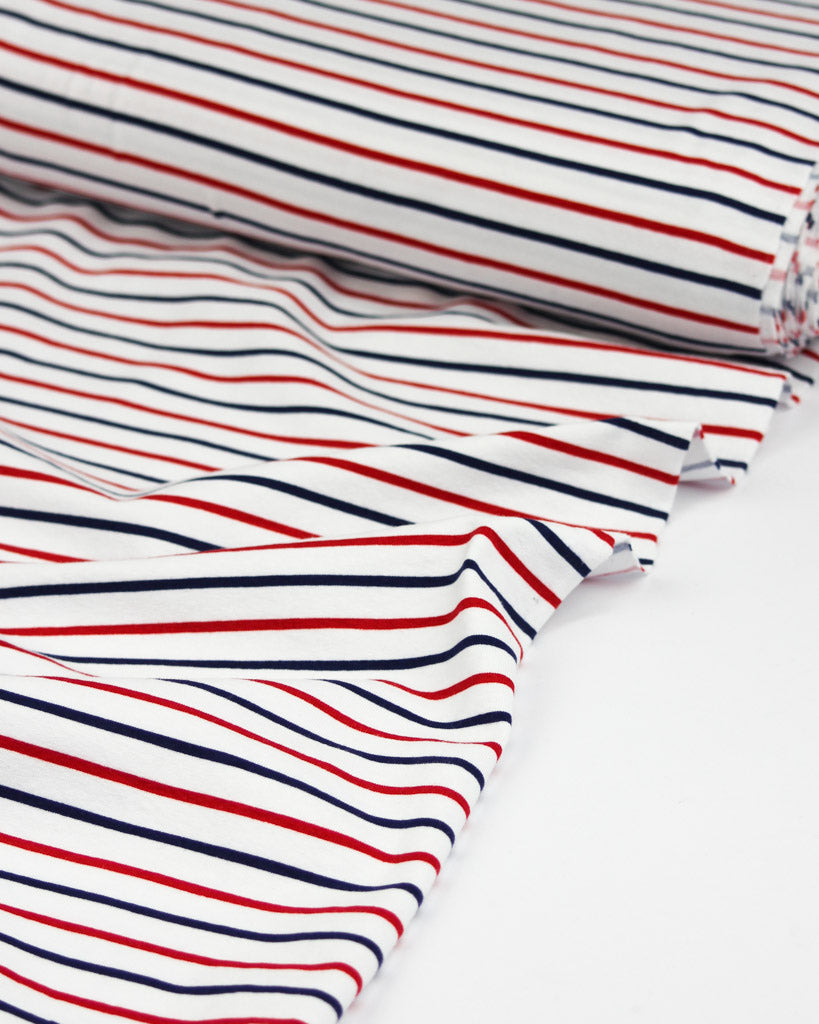 Close-up of red, white, and blue striped  cotton jersey fabric
