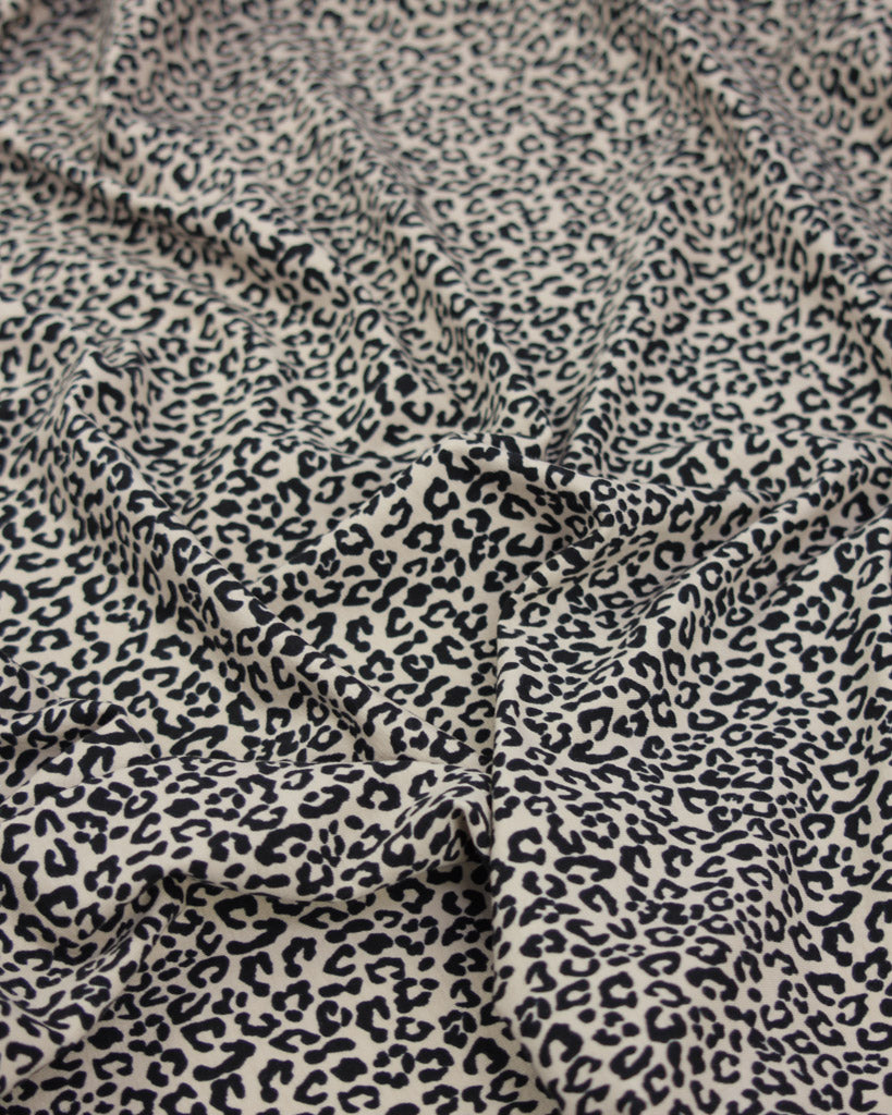 Leopard print cotton jersey fabric with a close-up view