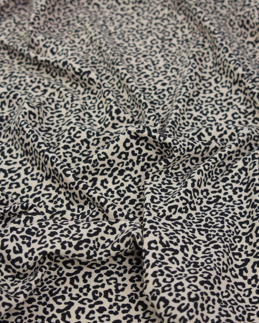 Leopard print cotton jersey fabric with a close-up view