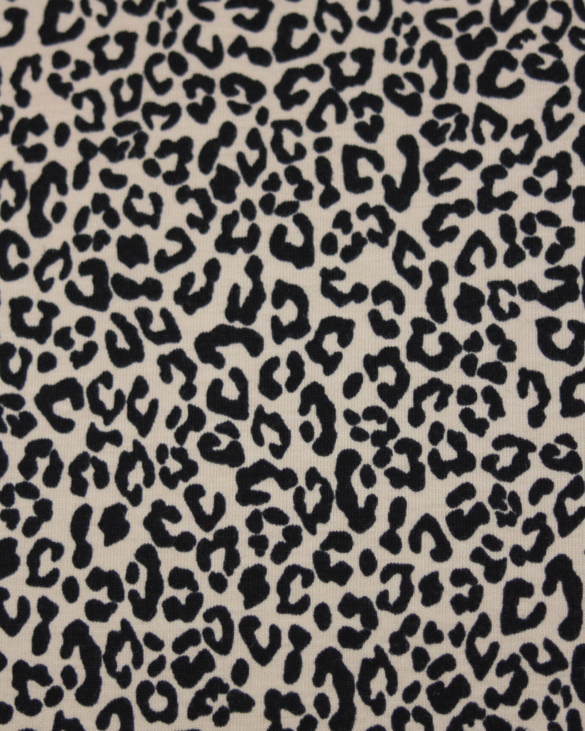 Leopard print pattern on a beige background on soft cotton jersey fabric