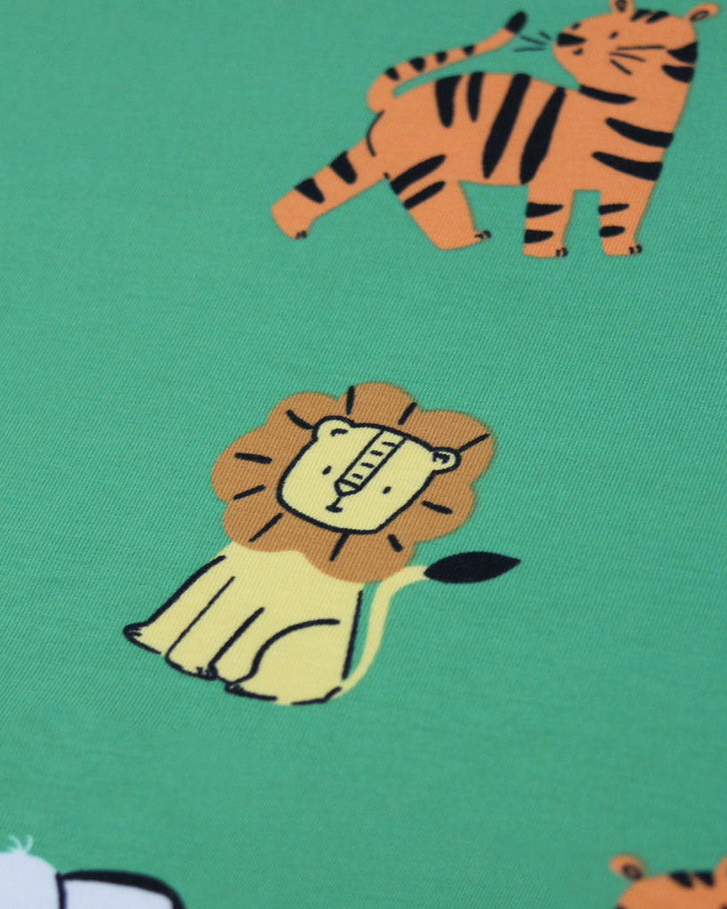 Illustrations of a lion and a tiger on a green background on cotton jersey fabric