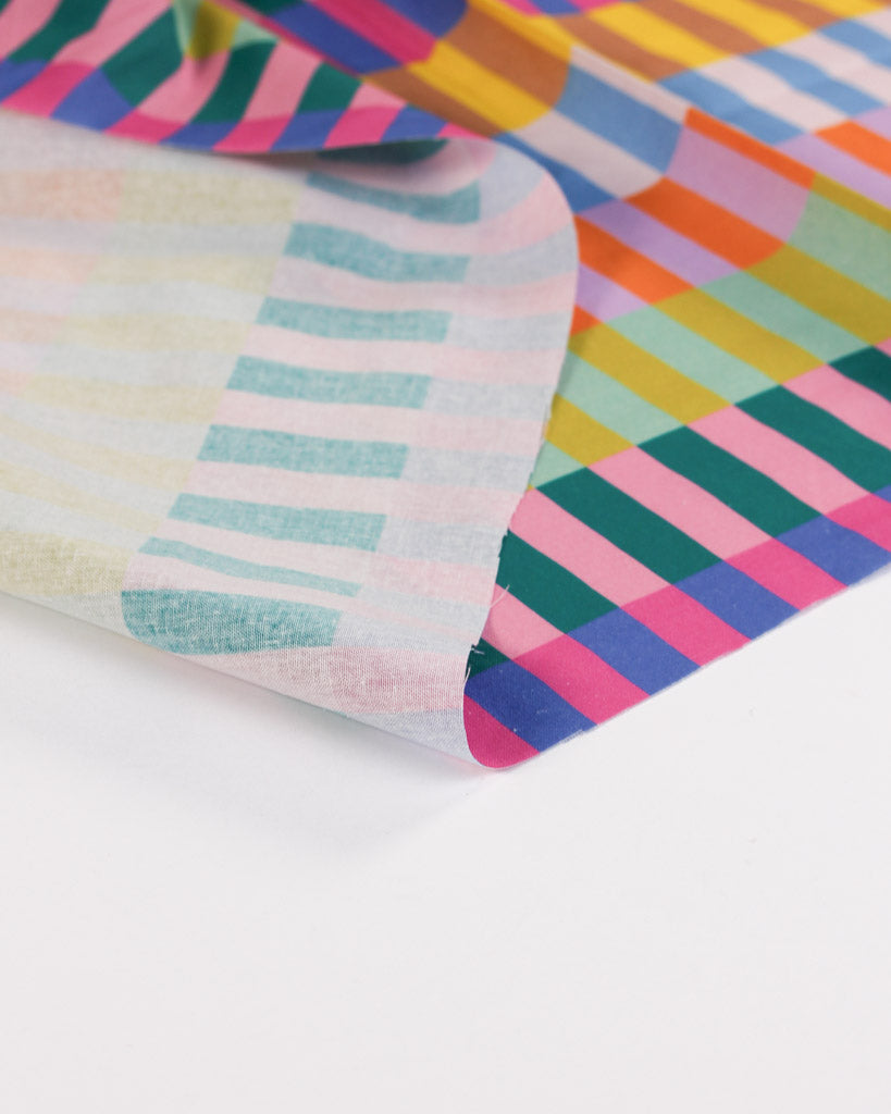 Close-up of colourful cotton fabric with striped and checkered patterns